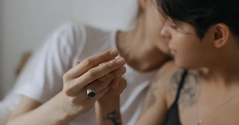 Intimate scene of a couple sharing an affectionate moment, highlighting love and connection.