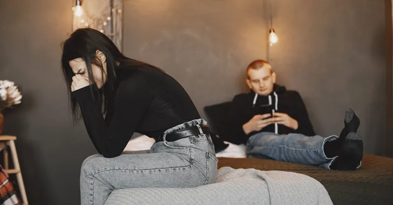 A couple experiencing tension and distance, highlighting relationship challenges.