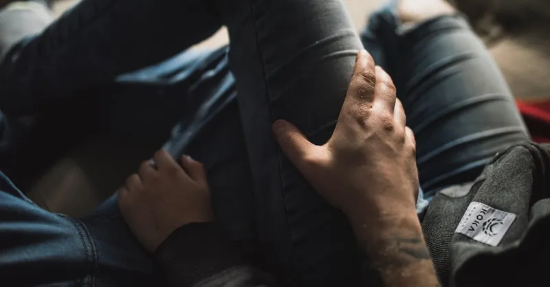 A close-up view of a couple relaxing, showcasing intimacy and comfort.